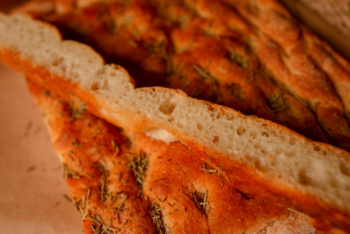Close-up of golden rosemary focaccia bread